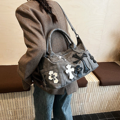 cross embedded bag