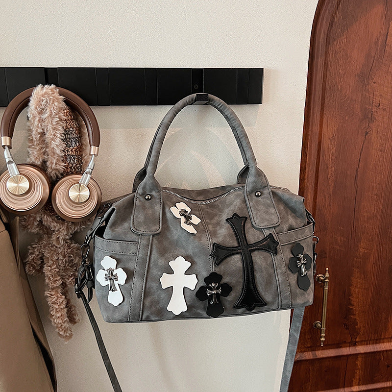 cross embedded bag