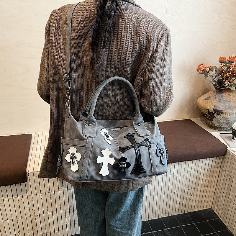 cross embedded bag