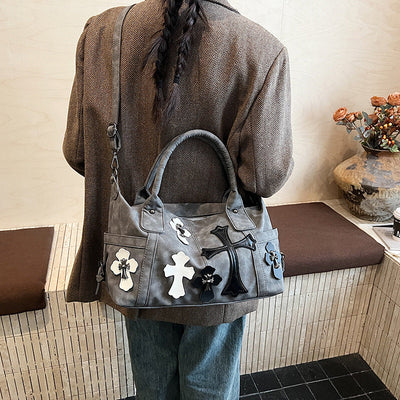 cross embedded bag
